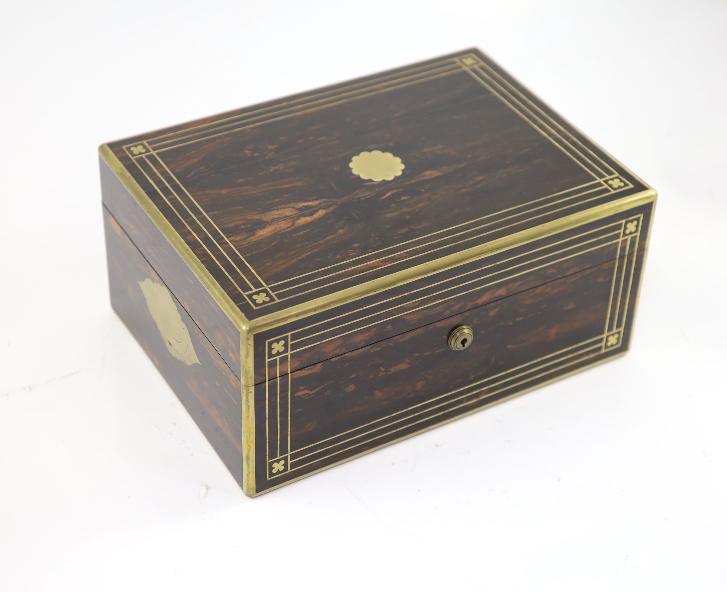 A good late William IV brass inlaid two handled coromandel wood travelling toilet set, containing eleven silver mounted glass jars etc.